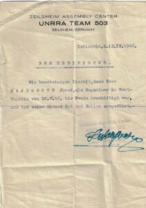 Certificado a nombre de José Mayerson, que describe su buen desempeño como empleado de la Revista Brot, UNRA Team 503, Zeilsheim Assembly Center. Alemania, 1946.